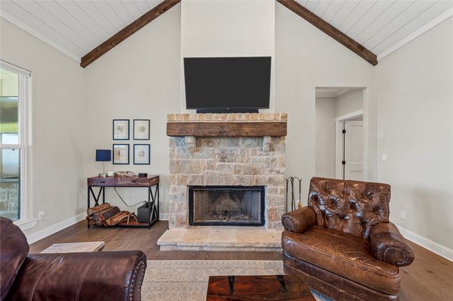 Living room featuring wood finished floors, baseboards, and wooden ceiling | Image 4