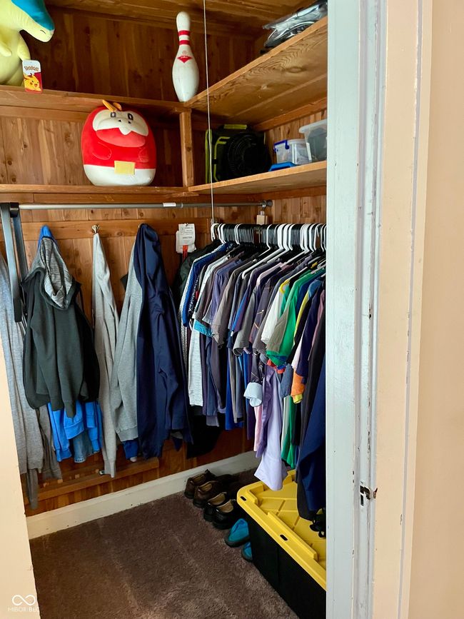 spacious closet with carpet flooring | Image 13