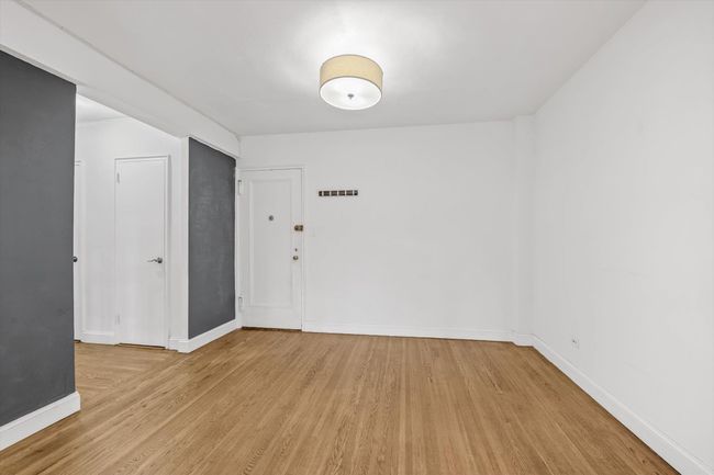 Empty room featuring light wood-style flooring and baseboards | Image 5