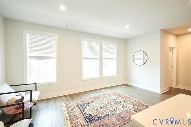Living area with recessed lighting and wood finished floors | Image 42