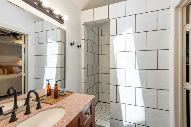 Bathroom featuring vanity, a ceiling fan, and a walk in shower | Image 18