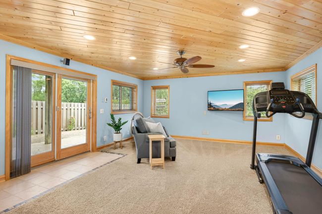 Gather for a movie night in the bright and spacious Lower Level Family Room that walks out to your backyard! | Image 29