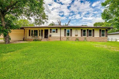 Single story home featuring a front lawn and a porch | Image 2