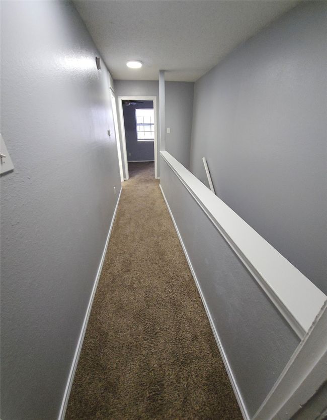 Hall with carpet floors and an upstairs landing | Image 15