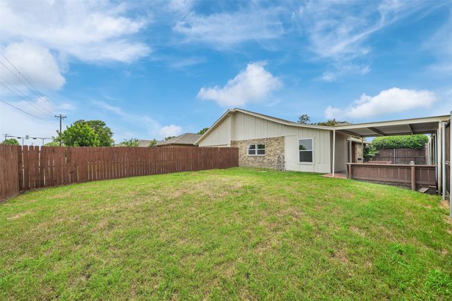 View of fenced backyard | Image 28