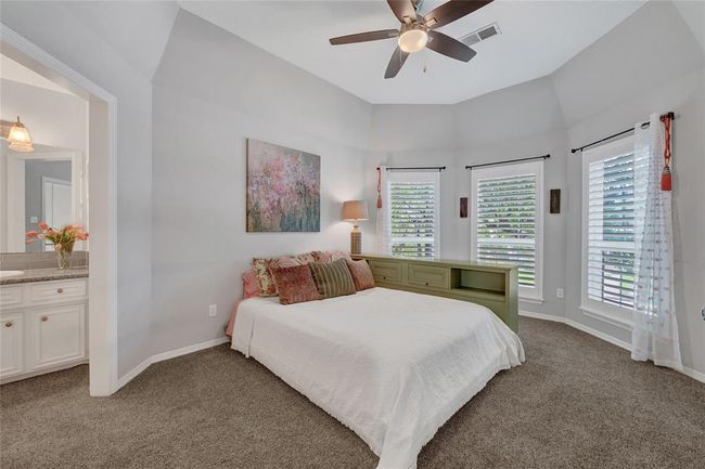 Precious secondary bedroom upstairs. Notice the details in the bay style windows and separate vanity area. | Image 30