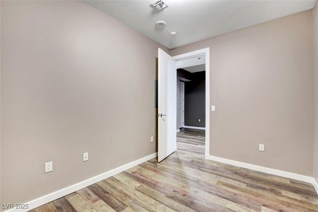 Second Bedroom featuring light wood-type flooring, visible vents, and baseboards | Image 26
