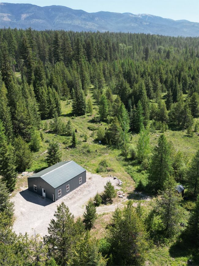 View of subject property with a forest and mountains | Image 29