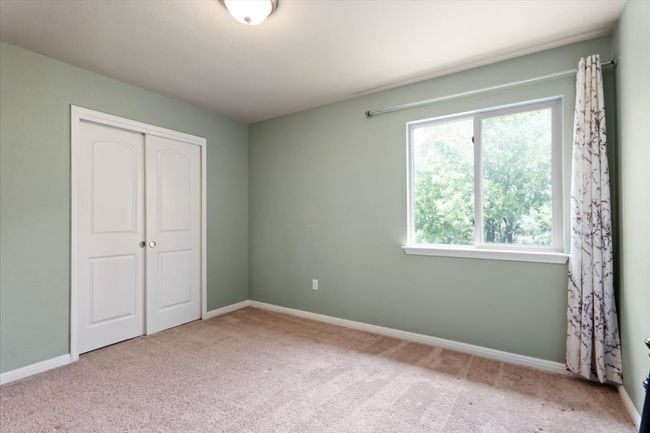 Second bedroom at the back of the home and overlooking the greenbelt. | Image 24
