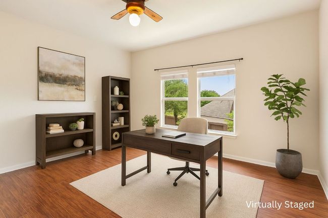 Office area featuring wood finished floors and ceiling fan | Image 31