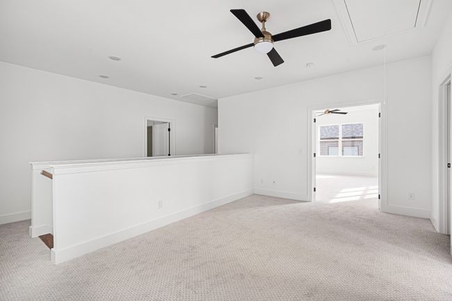 Upstairs features a loft area as well as a bonus room | Image 17