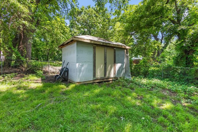 View of shed with a fenced backyard | Image 23