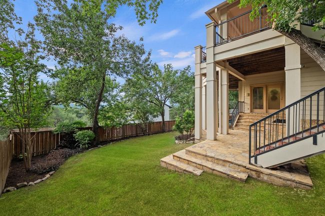 Fenced backyard with stairway and a patio | Image 26