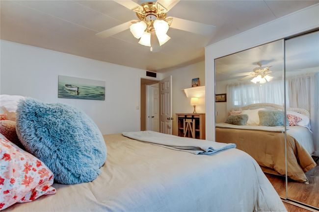 42. Bedroom #2 (11.6' x 13.2') Offers Standard Closet w Mirrored Sliders, Ceiling Fan, & Gorgeous Furnishings.. & Super Comfy Bed!! | Image 41