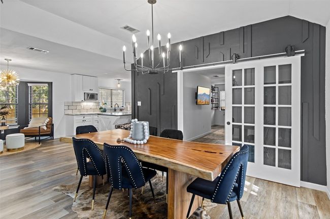 A formal dining room creates an inviting space for meals and hosting guests. | Image 4
