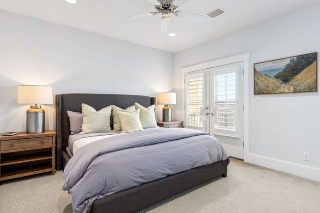 Bedroom with french doors, baseboards, access to exterior, visible vents, and light carpet | Image 22