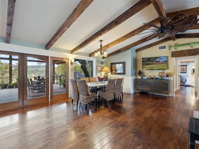 The dining area is part of the great room and overlooks the back patio. | Image 4