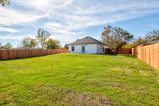 View of fenced backyard | Image 20