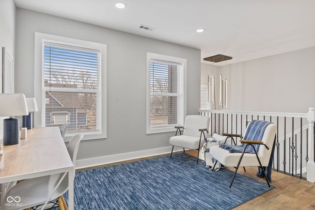 Loft or home office with recessed lighting, wood finished floors, visible vents, and baseboards | Image 31