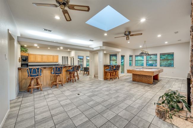 Kitchen with breakfast bar opens to family room, game room, wet bar and breakfast area | Image 13