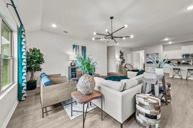 Living room with light wood-style floors, a chandelier, recessed lighting, and baseboards | Image 5