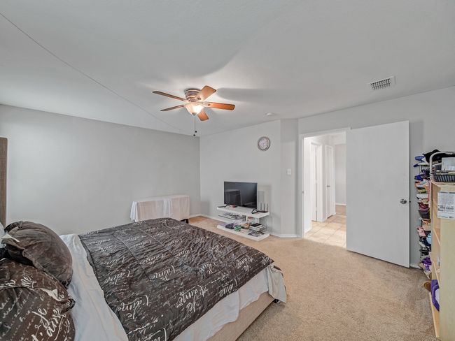 Bedroom with carpet floors and ceiling fan | Image 17