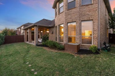 Back house at dusk with a yard | Image 3