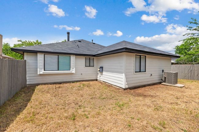 Rear view of property with a fenced backyard, and a lawn | Image 33