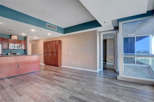 Unfurnished living room featuring recessed lighting, baseboards, visible vents, and light wood-style flooring | Image 5