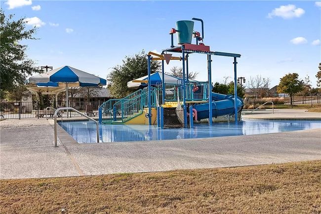 Crystal Falls has abundant amenities including a community splash pad and playground | Image 8