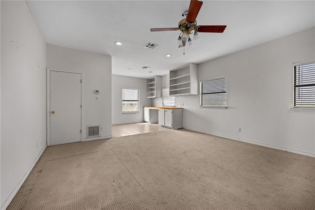 Bonus room in rear of garage with HVAC system and half bath | Image 32