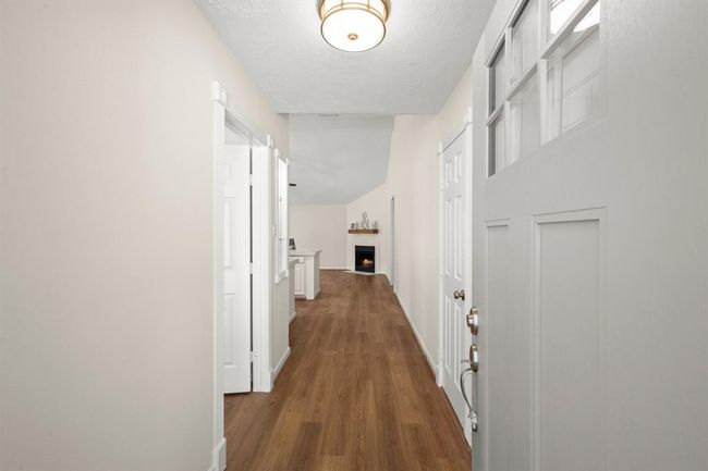 Painted walls, updated fixtures, and sleek vinyl flooring extend into the hallways and utility areas—ensuring continuity and durability throughout | Image 28