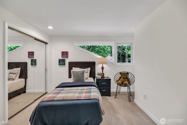 Third bedroom on upper level offers extreme privacy yet plenty of light | Image 26