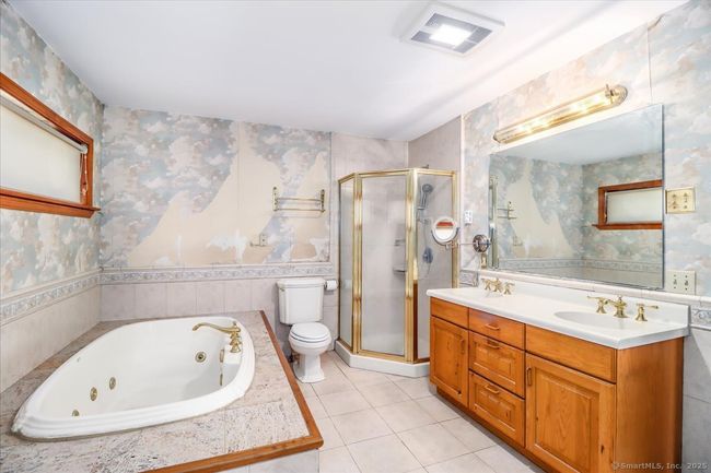 This main bathroom is in the main bedroom suite. | Image 37