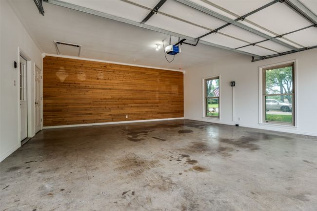 Garage featuring decorative wooden wall!! | Image 27