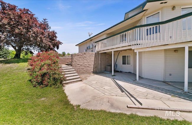 View of green lawn featuring a patio and stairway | Image 44
