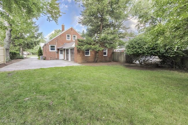 View of yard featuring central AC | Image 48