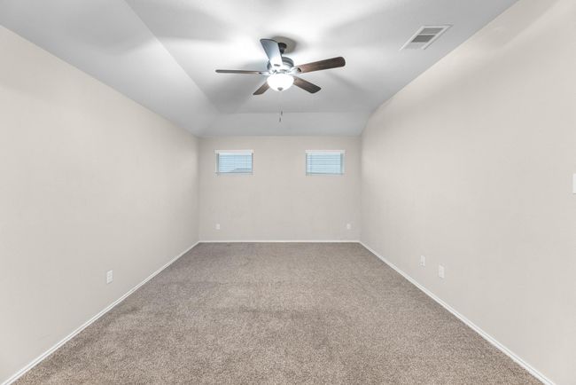 Upstairs you are greeted with a large Gameroom complete with a fan. | Image 33