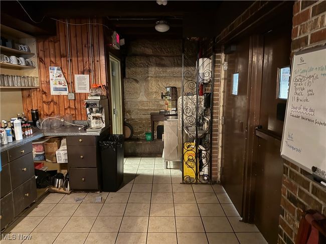 Wine area with light tile patterned floors | Image 28