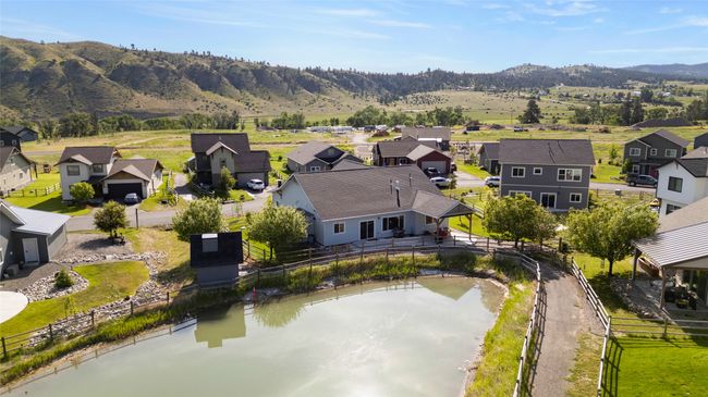 Aerial view of residential area featuring a water and mountain view | Image 35