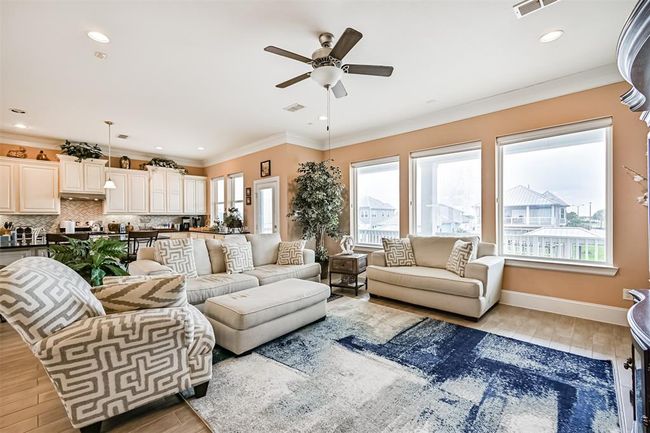 Entertain in this elegant den that has a deck in both the front and the back | Image 31