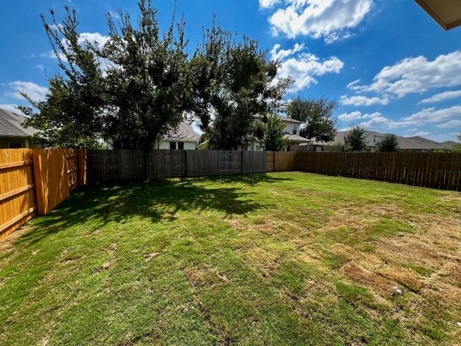 View of fenced backyard | Image 20