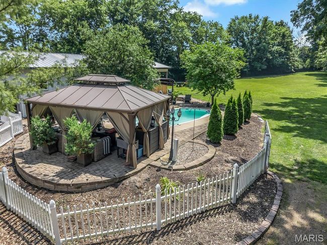 Swimming pool featuring a gazebo and a patio | Image 17