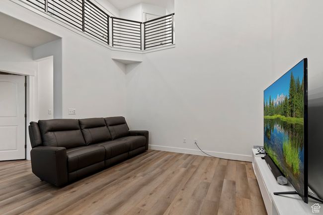 Living room featuring a high ceiing | Image 8