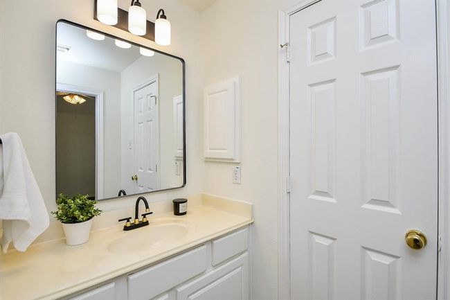 The second vanity area in the Jack and Jill bathroom offers its own space for getting ready, making morning routines smooth and stress-free! | Image 30