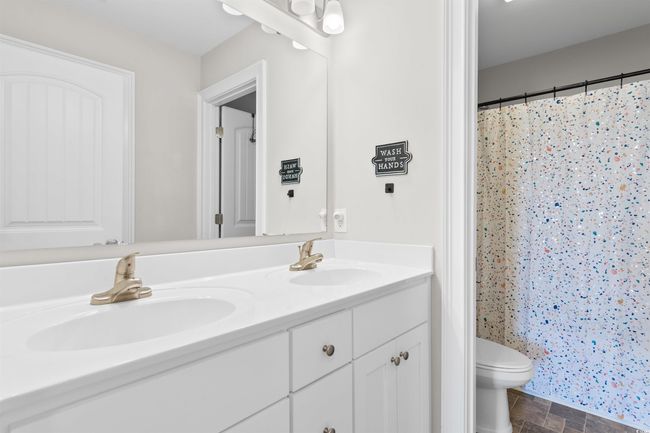 Full bath with double vanity and a shower with shower curtain | Image 29