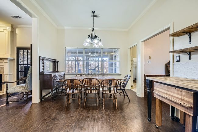 Back inside, your entire family can congregate in this large eat-in dining space off the kitchen! Large laundry room and pantry to the right of the breakfast area. | Image 28