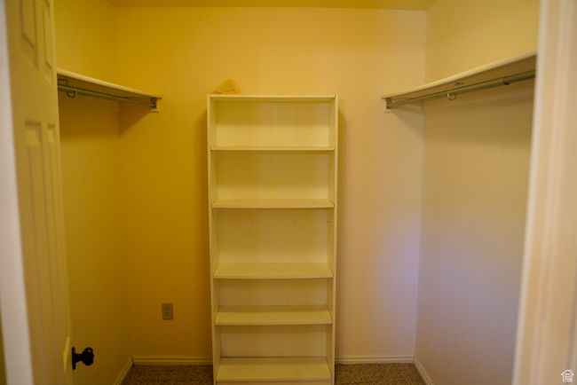 Spacious closet with carpet floors | Image 16