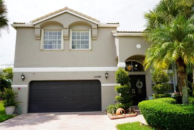 15991 Nw 14th Rd, House other with 4 bedrooms, 3 bathrooms and null parking in Pembroke Pines FL | Image 1