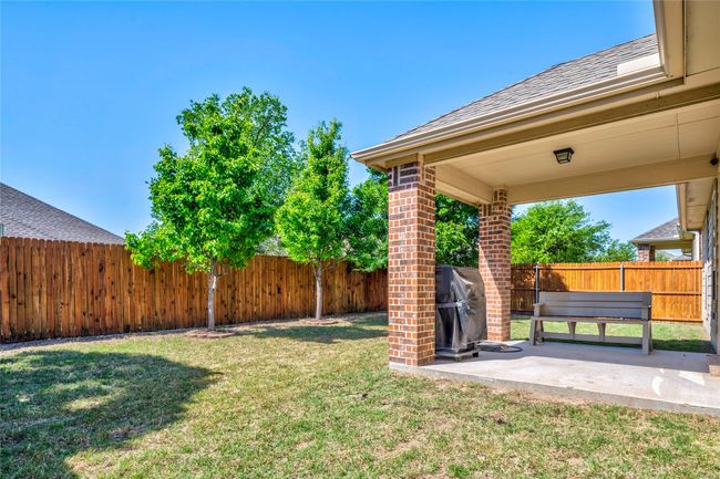 View of yard featuring a patio and a fenced backyard | Image 35